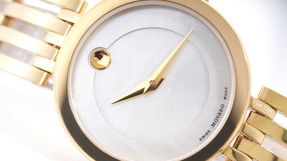 Đồng hồ Movado 0607054 - Bộ 2 kim dauphine và chấm tròn đặc trưng được mạ PVD vàng gold nổi bật Bộ 2 kim dauphine và chấm tròn đặc trưng được mạ PVD vàng gold nổi bật 