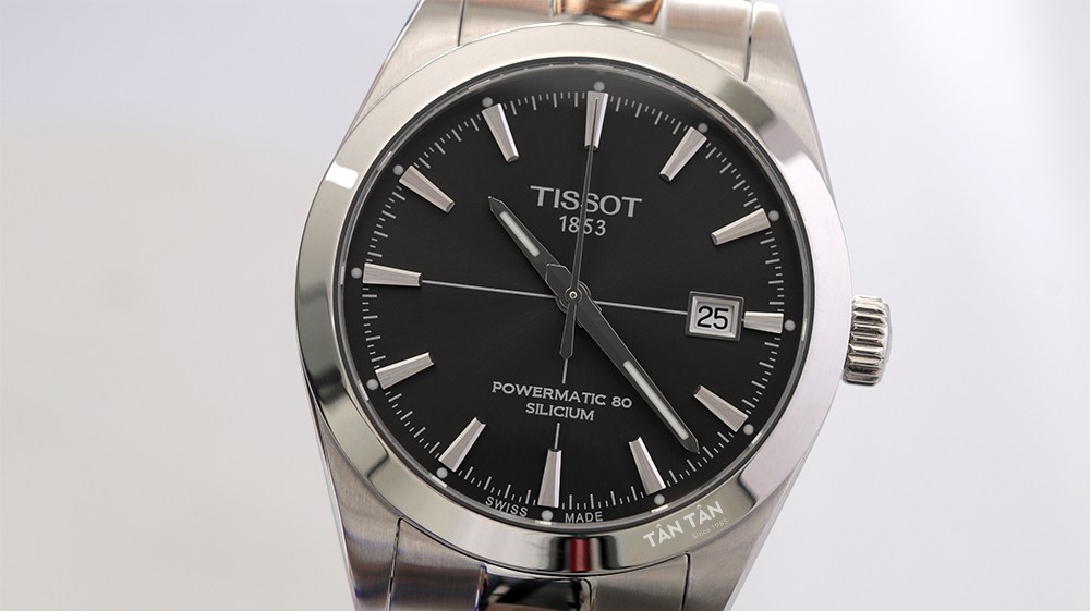 Đồng hồ Tissot T127.407.11.061.01 - Mặt số màu đen chải tia sunburst sang trọng với các chi tiết màu bạc nổi bật 