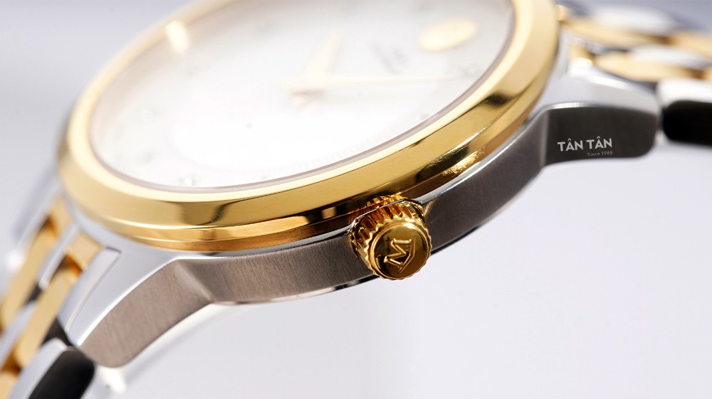 Đồng hồ Movado 0607489 - Niềng bezel và núm chỉnh giờ được mạ vàng gold thu hút của Movado 0607489  